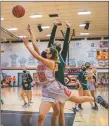  ?? ?? The Lady Tigers Marika Moyer shoots the ball during a game against Los Alamos on Saturday (Jan. 29).