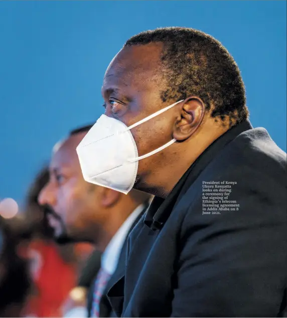  ??  ?? President of Kenya Uhuru Kenyatta looks on during a ceremony for the signing of Ethiopia’s telecom licensing agreement in Addis Ababa on 8 June 2021.