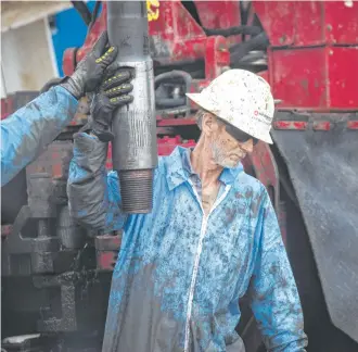  ?? Marie D. De Jesús photos / Houston Chronicle ?? Workers drill near College Station using a Patterson-UTI Drilling Co. rig. Patterson-UTI has deployed all of its super-spec rigs and has set aside funds to upgrade other machines in its fleet.