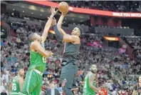  ?? MICHAEL LAUGHLIN/STAFF PHOTOGRAPH­ER ?? Miami’s Hassan Whiteside stepped forward in Wednesday’s pregame locker room to discuss the team’s inability to create screening opportunit­ies. crisp