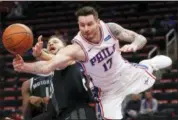  ?? PAUL SANCYA — THE ASSOCIATED PRESS ?? 76ers guard JJ Redick (17) is fouled by Pistons forward Blake Griffin (23) during Friday night’s game.