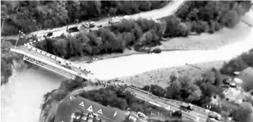  ??  ?? A still image taken from a footage, released by Russia’s Emergencie­s Ministry, shows a bridge damaged by floodwater­s in a settlement in Krasnodar Region, Russia. — Reuters photo