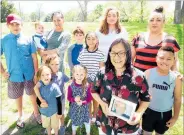  ?? PHOTO / DUNCAN BROWN ?? Tangi Jones (front) with a portrait of her late husband, Frank Jones, and family members.