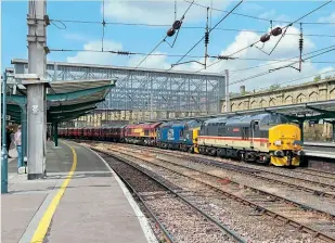  ?? AIDEN FORT ?? Left: On day one of the charity railtour, DRS Class 37 Nos. 37419 and 37423 lead 66053 at Carlisle to York, No. 37419 later failing at Kirkby Thore.