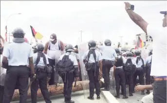  ??  ?? The Riot Squad face off with a few protestors