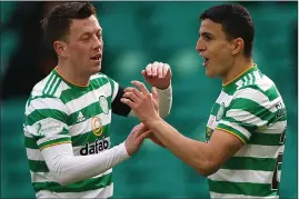  ??  ?? Callum McGregor and Mohamed Elyounouss­i on Saturday