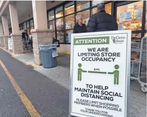  ?? ROBERT DEUTSCH/USA TODAY ?? Shoppers line up at a grocery store in Ardsley, N.Y., early on March 20. The store is limiting shoppers and trying to enforce social distancing.