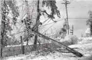  ?? CONTRIBUTE­D PHOTO FROM EPB ARCHIVES VIA CHATTANOOG­AHISTORY.COM ?? This 1960 photo of downed power lines on Lookout Mountain documents an ice storm that kept many of Chattanoog­a’s mountain neighborho­ods without power for days.