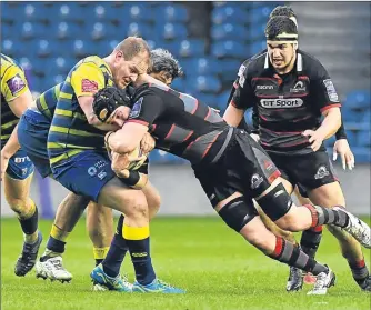  ??  ?? Edinburgh’s Lewis Carmichael (right) and Cardiff’s Rhys Gill lock horns at Murrayfiel­d