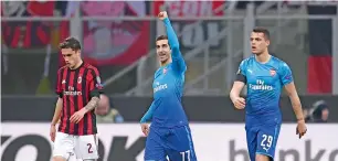  ?? AFP ?? arsenal’s henrikh Mkhitaryan (centre) celebrates after scoring a goal against aC Milan during the ueFa europa League match. —