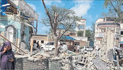  ??  ?? The rubble of the Asasey Hotel in Kismayo, Somalia