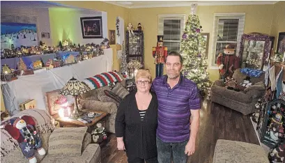  ?? SCOTT GARDNER PHOTOS THE HAMILTON SPECTATOR ?? Cheryl and Cory Stark stand in their living room, which shows just the tip of the iceberg for their Christmas decorating.