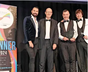 ?? ?? ● Phillip Gahan, of Runcorn, on stage at the Great British Care Awards with awards presenter and special celebrity guest Rylan Clark