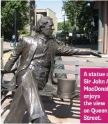  ??  ?? A statue of Sir John A. MacDonald enjoys the view on Queen Street.