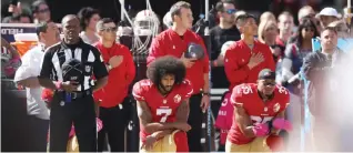  ??  ?? SANTA CLARA: This file photo taken on October 22, 2016 shows Eric Reid #35 and Colin Kaepernick #7 of the San Francisco 49ers kneeling in protest during the national anthem prior to their NFL game against the Tampa Bay Buccaneers at Levi’s Stadium in...