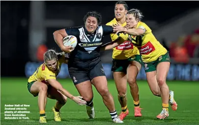  ?? GETTY IMAGES ?? Amber Hall of New Zealand attracts plenty of attention from Australian defenders in York.