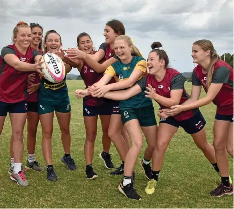  ?? Photo: Bev Lacey ?? HAVING A BALL: Downs rugby sevens players chosen in the 2018 Queensland youth teams and under-15 developmen­t squad (from left) Kayla Jackson, Lily Black, Alex McDonald, Jayda Ferguson, Taleah McGrane, Ella Kowitz, Holly Anlezark and Paige Edwards.