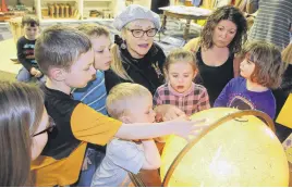  ?? LYNN CURWIN/TRURO NEWS ?? During a visit to the Dr. Jane Norman Child Study Centre, Lenore Zann used a globe to show children the route she and her family travelled when they first came to Canada. The Cumberland Colchester MP also told the children stories and commended them for their efforts to help Australian wildlife.