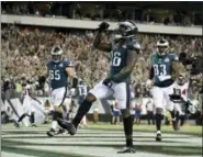  ?? MICHAEL PEREZ - AP ?? Philadelph­ia Eagles’ Jay Ajayi celebrates after scoring a touchdown during the second half of an NFL football game against the Atlanta Falcons on Thursday, in Philadelph­ia.