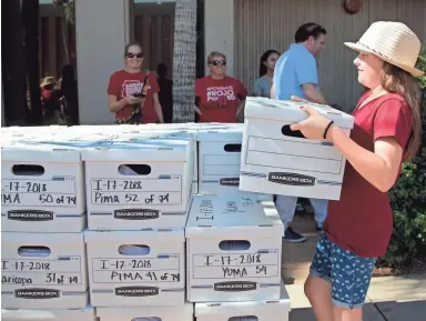  ??  ?? Top: Sadie Williams, 11, of Scottsdale helps the Invest in Education campaign turn in more than 270,000 signatures supporting the initiative at the state Capitol on Thursday.