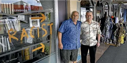  ?? DAVID UNWIN/STUFF ?? John Preston and his husband Peter Thornton’s Woodville business Antique Fabric and Lace has been branded racist by the neighbouri­ng shop.