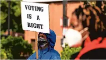  ?? PAUL W. GILLESPIE/CAPITAL GAZETTE ?? Protesters gather at The People’s Park in Annapolis on Saturday for“John Lewis Voting Rights Act” day.