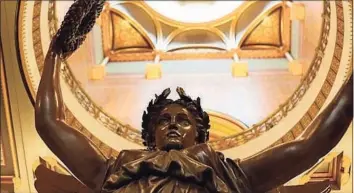  ?? Ctnewsjunk­ie file photo ?? The Genius of Connecticu­t statue in the rotunda of the state Capitol is a 2009 copy of the original sculpture, which stood atop the gold Capitol dome from 1878 until 1938.