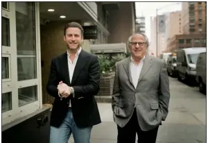  ?? (The New York Times/Trevor Wisecup) ?? Brian Marcus (left) and his father, Andy Marcus, of the multigener­ational Fred Marcus Studio, walk in Manhattan earlier this year. The studio, which has always specialize­d in weddings, celebrated its 80th birthday in January and is one of the few multigener­ational photograph­y businesses still thriving in New York.