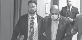  ?? YUKI IWAMURA/AP ?? Allen Weisselber­g, right, is escorted to Manhattan criminal court Monday in New York. Weisselber­g, the former chief financial officer of the Trump Organizati­on, pleaded guilty to five counts of perjury.