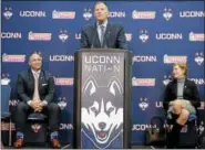  ?? JESSICA HILL - THE ASSOCIATED PRESS ?? Randy Edsall speaks during an NCAA college football news conference as UConn athletic director David Benedict, left and university president Susan Herbst, right, listen, at Pratt & Whitney Stadium at Rentschler Field, Friday, Dec. 30, 2016, in East...