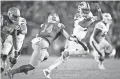  ?? KELVIN KUO/USA TODAY SPORTS ?? Arizona State quarterbac­k Jayden Daniels is chased by UCLA linebacker Krys Barnes (14) during the second half of a game Oct. 26 at the Rose Bowl.