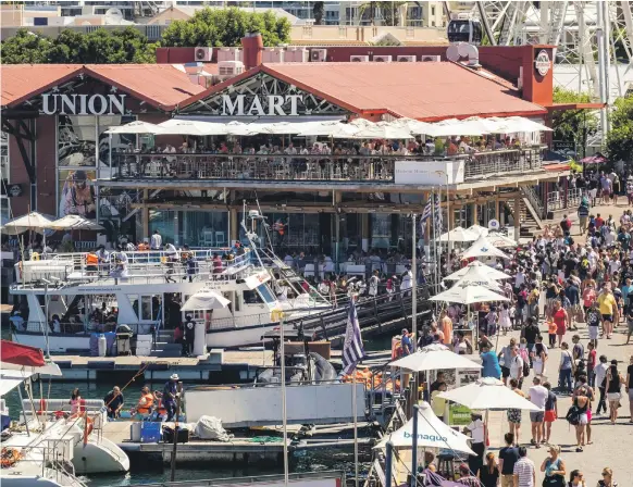  ??  ?? Cape Union Mart on Cape Town’s waterfront is a popular summer spot – but the cost of a taxi home will leave a hole in your wallet