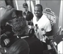  ?? JOHN BAZEMORE / The Associated Press ?? Dwight Freeney answers questions after officially signing with the Falcons on Thursday.