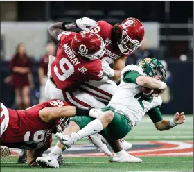  ?? (AP file photo) ?? Oklahoma and Baylor compete in last year’s Big 12 Championsh­ip Game, which Oklahoma won 30-23 in overtime. The league decided Monday it will play nine conference games and one nonconfere­nce game this year.