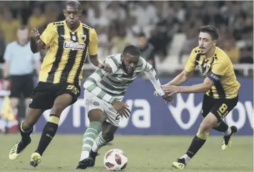  ??  ?? Main picture: Scott Sinclair, centre, goes after the ball after heading home past AEK Athens’ goalkeeper Vassilis Barkas in the 78th minute to give Celtic late hope. Left, Alef and Andre Simoes chase down Celtic midfielder Olivier Ntcham and, below, Jack Hendry vies for control of the ball with Athens goalscorer Marko Livaja.