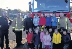  ??  ?? Special visit Tots from Kiwi Playgroup are shown around a fire engine