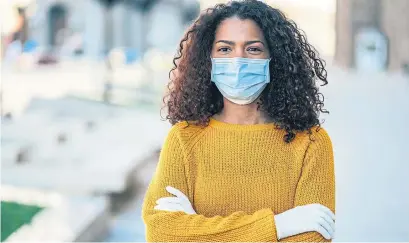  ?? FILADENDRO­N GETTY IMAGES ?? You should throw away disposable masks right after using them, one expert says. If you must reuse it, let it dry out for three days.