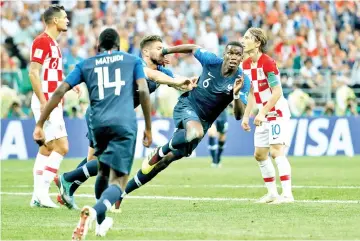  ??  ?? France’s midfielder Paul Pogba (second right) celebrates scoring the 3-1 goal during the World Cup final match against Croatia at the Luzhniki Stadium in Moscow in this July 15 file photo. — AFP photo