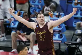  ?? PAUL SANCYA — THE ASSOCIATED PRESS ?? Loyola Chicago center Cameron Krutwig (25) reacts to a basket against the Illinois during the second half of a second round NCAA tournament game at Bankers Life Fieldhouse in Indianapol­is on Sunday.