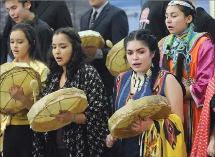  ?? GARY NYLANDER/The Daily Courier ?? Academy of Indigenous Studies leadership students perform The Okanagan Song Monday at Mount Boucherie Secondary School in West Kelowna. MBSS has been recognized for raising the high school graduation rate for Indigenous students from 55 per cent in...