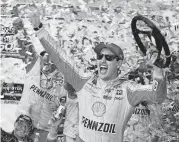  ?? [STEVE HELBER/THE ASSOCIATED PRESS] ?? Joey Logano celebrates Sunday after winning the Monster Energy NASCAR Cup Series race at Martinsvil­le Speedway in Martinsvil­le, Va.