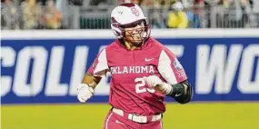  ?? Sue Ogrocki/Associated Press ?? Oklahoma’s Tiare Jennings runs during the first game of the NCAA Women’s College World Series softball championsh­ip series against Texas on June 8 in Oklahoma City. Jennings may be the nation’s best player. She dominated at last year’s Women’s College World Series, setting records with 15 RBIs and five home runs.