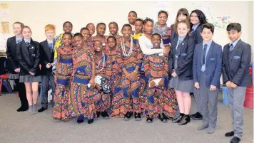  ??  ?? The Bethany Family from Tanzania with pupils at Alder Grange School