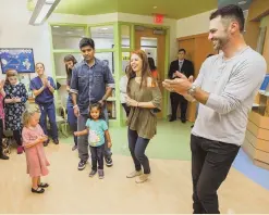  ?? PHOTO COURTESY OF MASSACHUSE­TTS EYE AND EAR ?? Anna Trebunskay­a and Tony Dovolani of ‘Dancing with the Stars’ visit the pediatric unit at Massachuse­tts Eye and Ear ahead of the annual Sense-ation! Gala.