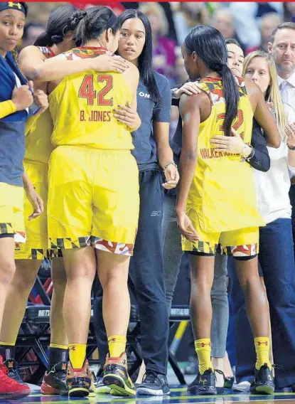  ?? JESSICA HILL/ASSOCIATED PRESS ?? Maryland’s Brionna Jones and Shatori Walker-Kimbrough come out of the game in the final minute of the Terps’ 77-63 loss to Oregon on Saturday in Bridgeport, Conn. It was a second straight early tournament exit for Maryland and its two senior stars.