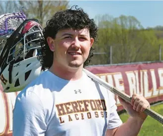  ?? MATT BUTTON/BALTIMORE SUN MEDIA ?? During his athletic career, Hereford senior Baylor Davis has dealt with his father’s death and a pair of concussion­s. He remains passionate about the game of lacrosse, which has helped him find a path forward.