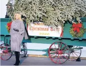  ?? ANDREW HARNIK/AP ?? First lady Melania Trump stands next to the official White House Christmas tree Monday.