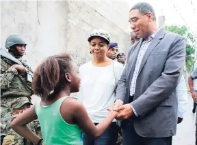  ??  ?? Prime Minister Andrew Holness is commending the restoratio­n of peace in Mount Salem, St James, and the willingnes­s of residents to support initiative­s to better their lives.