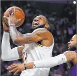  ?? Mark J. Terrill The Associated Press ?? Lakers forward Lebron James goes hard to the basket in a March 8 Southern California rivalry game against the Clippers in Los Angeles.