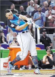  ?? Wilfredo Lee ?? The Associated Press New York Yankees rookie outfielder Aaron Judge swings for the fences — literally — in winning the annual MLB All-star Home Run Derby on Monday at Marlins Park in Miami. Judge, seeded second, beat No. 5 seed Miguel Sano of the...